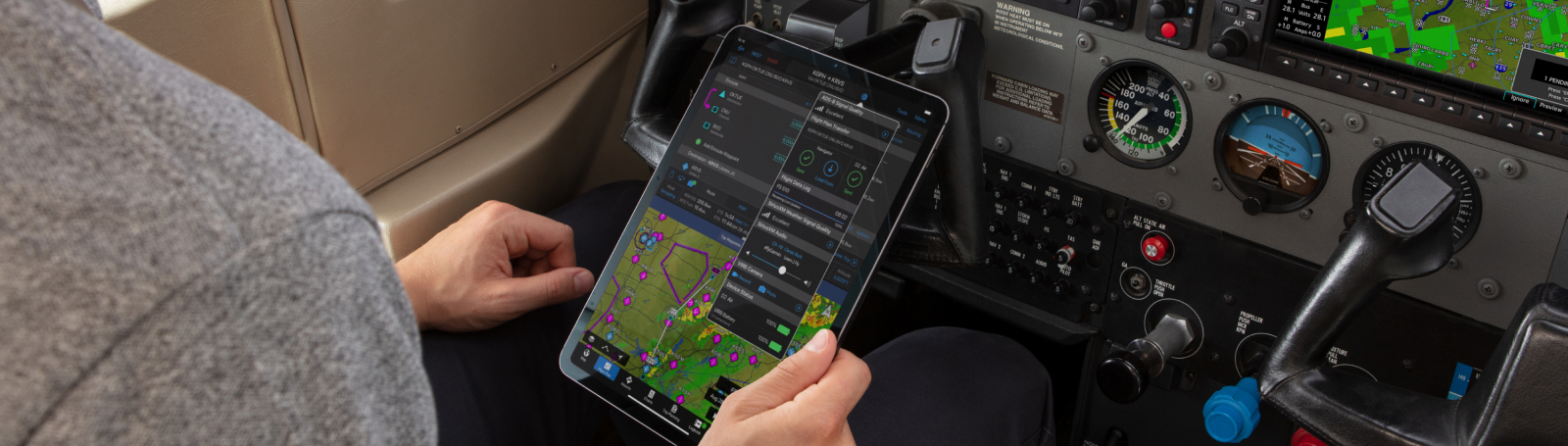 Looking over the shoulder of a pilot using Garmin Pilot on an iPad.